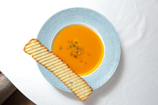 Plate with squash soup. View from the top.