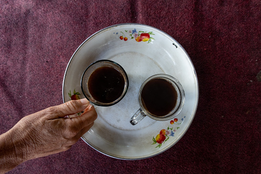 Two cups of Balinese coffee served at a road side truck stop