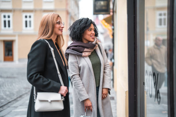 istock Happy Multiracial Women Window Shopping On The Weekend 1497744076
