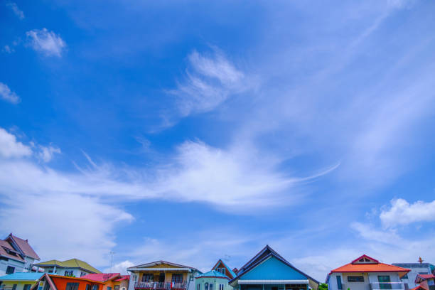 village against sky clouds, blue fluffy clean, bright weather light summer