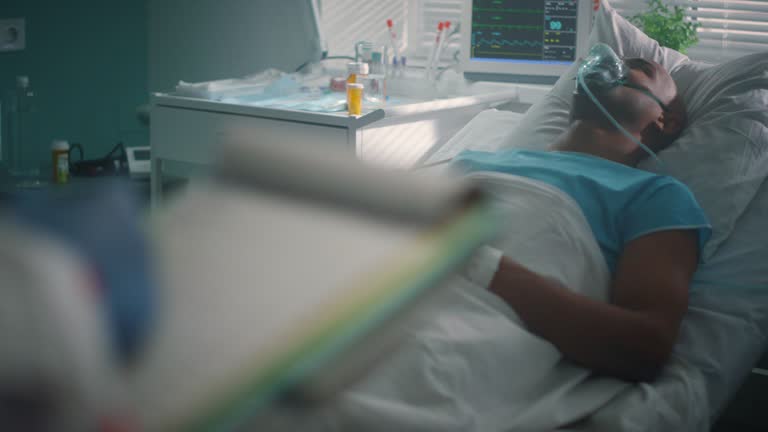 Nurse hands holding clipboard checking medical records in hospital ward closeup.