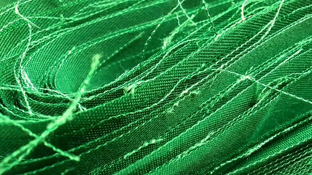 rolls of green cotton cloth