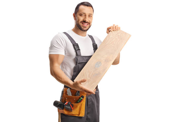 istock Carpenter holding a wooden floor beam 1497753964