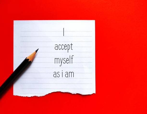 istock Note on red background with handwritten affirmation message I ACCEPT MYSELF AS I AM, concept of phrases statements repeated to help encourage self worth and raise self esteem, love and value self unconditionally 1497758244