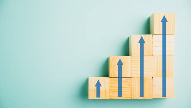 istock Wooden block stacking as a ladder career path concept 1497760398