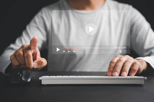 istock Elevate your entertainment experience with a touch as a man's hand interacts with the screen 1497760415