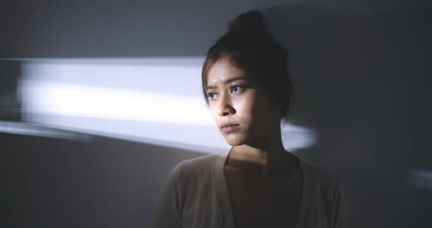 istock Asian Young woman with feels absent-minded and thoughtful with sorrow 1497761491