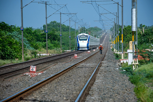 Pune, India - June 11 2023: The Solapur Mumbai Vande Bharat Express Train heading towards Mumbai, shot at Kedgaon near Pune India.