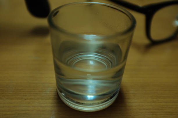 A glass with half fresh water