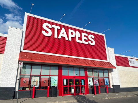 Calgary, Alberta, Canada. Jun 9, 2023. A Staples main entrance during spring.