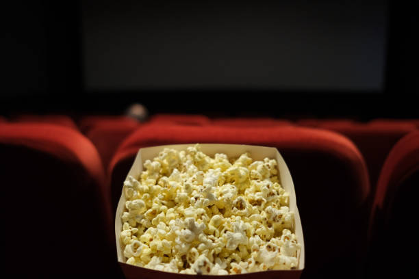 istock eating popcorn at the cinema 1497770892