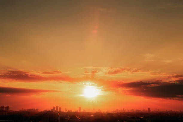 istock Sun rays  of sun over building silhouette, 1497773349