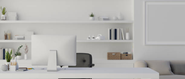 istock Interior design of a modern contemporary white office with computer desk 1497773797
