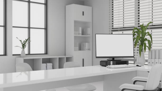 istock Interior design of a modern white office with computer mockup on a white desk. 1497773811