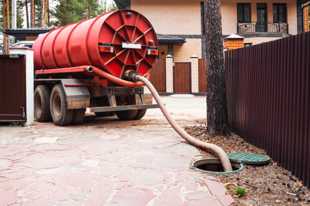 istock Sewer pumping machine. Septic truck. Pipe in the drainage pit. Pumping out sewage from a septic tank. Septic tank service 1497774763