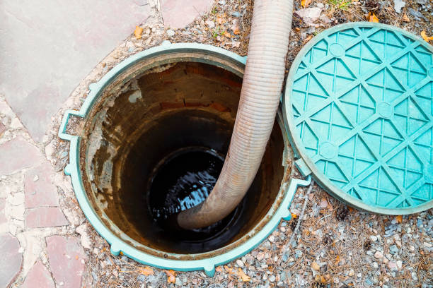 istock Pipe in the drainage pit. Pumping out sewage from a septic tank. Septic tank service 1497774767
