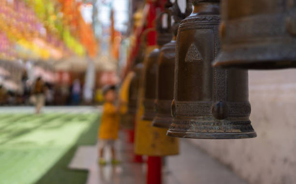 selective focus of old bronze bell in thailand temple with blur perspective background. - iron asian culture buddhism buddha imagens e fotografias de stock