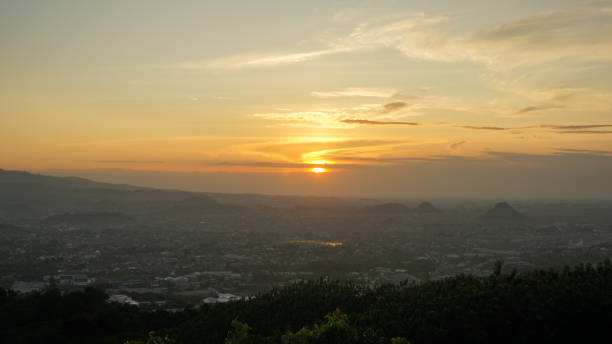 istock Sunset view with sky, cloud, Rajabasa mountain in Lampung view from Bukit Aslan or Aslan hill 1497777532