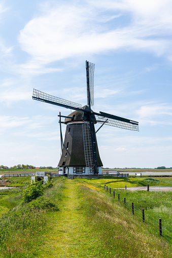 On a sunny day at the mill of the North on the island of Texel in the Netherlands