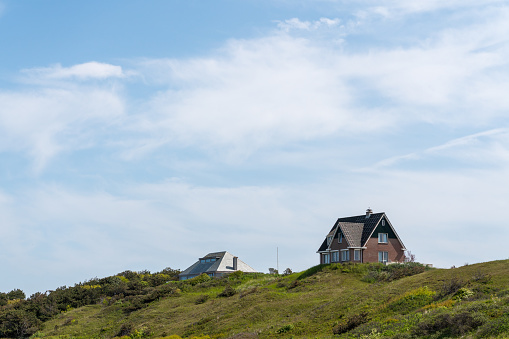 Cottages on the beach hills on a sunny day