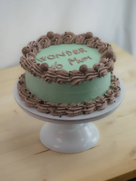 istock frosted icing elegnt cake with funny lettering topping. Mothers day celebration cupcake. 1497781585