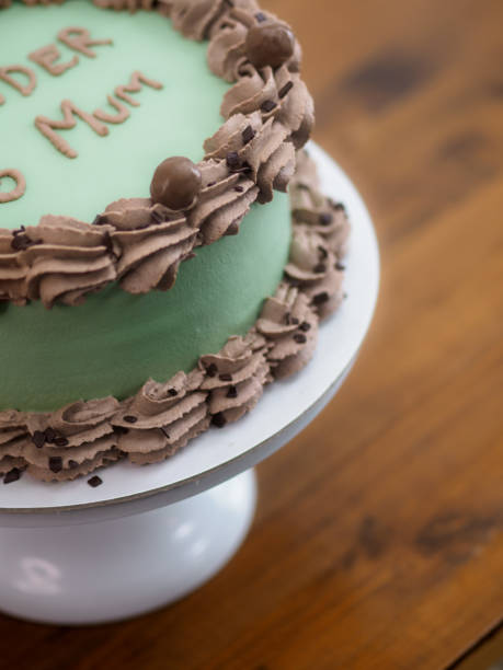 istock frosted icing elegnt cake with funny lettering topping. Mothers day celebration cupcake. 1497781604