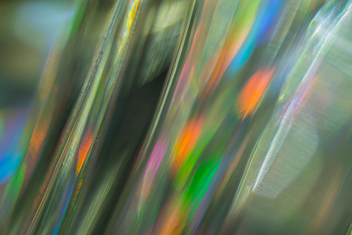 Abstract vibrant colored pattern. Polarized light view through glass structure. Dynamic multicolored artistic background.