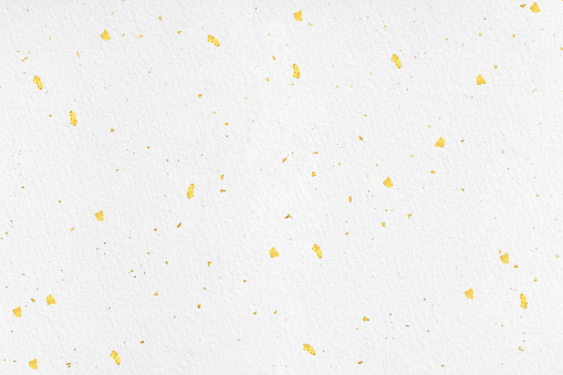 Background Texture of White Washi Paper with Gold Flecks.Japanese Paper with Gold Flecks
