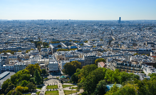 Aerial view of Paris with Champ-de-Mars, Eiffel Tower and skyscrapers of La Defense