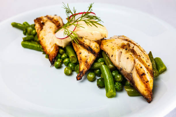 istock fish stake with green peas and green bean 1497794481
