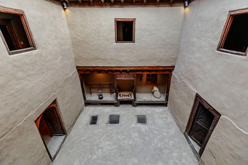 Khaplu Fort, Gilgit Baltistan, Pakistan - May 3, 2019: Exploring the exquisite interior of Khaplu Fort, a historic gem nestled in the heart of the breathtaking Himalayan region.\n\nKhaplu Fort is a centuries-old fort located in the town of Khaplu in the Gilgit-Baltistan region of Pakistan. The fort was built in the 19th century by the Yabgo dynasty rulers and served as a residence for the local rulers. \n\nThe fort boasts a beautiful and intricate architecture, with intricately carved wooden doors, spacious courtyards, and winding staircases. Inside, visitors can explore the various rooms that were once used as living quarters, reception halls, and even a prison. \n\nThe interior is decorated with traditional Balti artwork and features antique furniture and artifacts. The fort also offers stunning views of the surrounding Himalayan mountains and valleys. \n\nToday, the fort is open to visitors as a museum and cultural center, allowing visitors to experience the rich history and culture of the region.