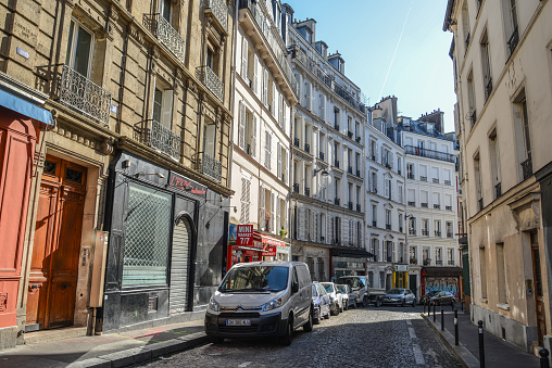 Paris, France - Oct 4, 2018. Beautiful old street in Montmartre district in Paris, France. Montmartre is a large hill in Paris 18th arrondissement.