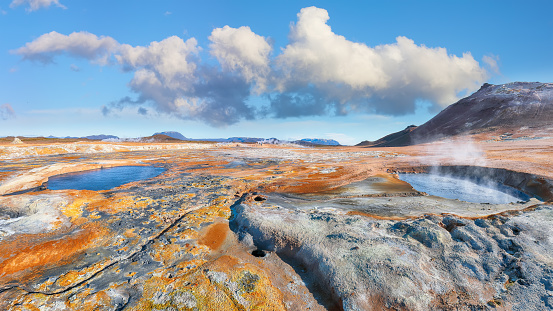 Breathtaking boiling mudpots in geothermal area Hverir and cracked ground around. Location: Hverir, Myvatn region, North part of Iceland, Europe