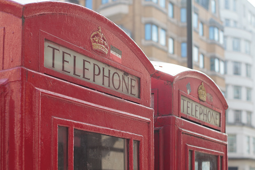 Close-Up view of Telephone sign on Red Telephone Box in London,UK
