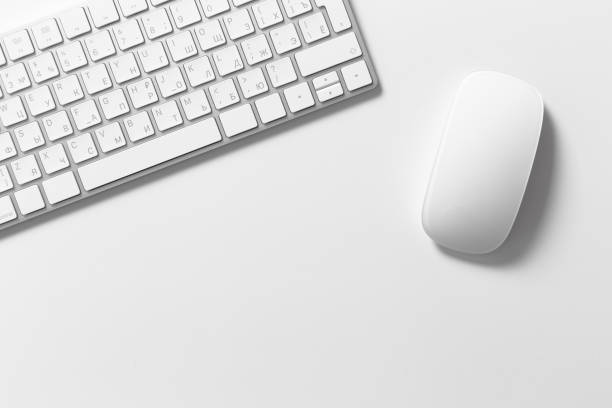 istock Computer keyboard and mouse on top of white desktop 1497804550