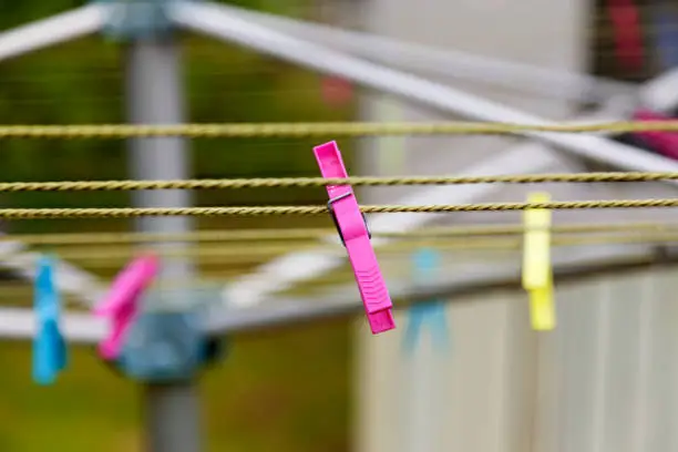 pink clothespin on drying rack in Umea