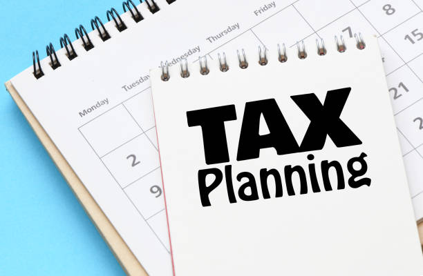 istock TAX PLANNING words in a notebook on a calendar. 1497806881