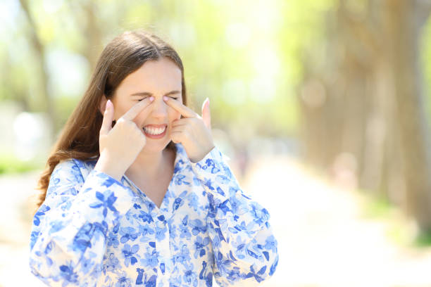 istock Stressed woman scratching eyes in a sunny park 1497807746