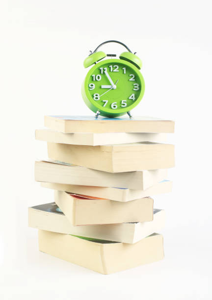 Alarm Clock and Books, Back to school concept ,Workload Deadline Concept