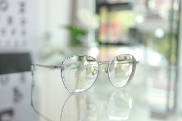 istock Eyeglasses on table, progressive lenses, eyeglasses for the elderly, glasses progressive lens, eyeglass progressive lens, close-up of glasses on blur background, looking through glasses 1497808945