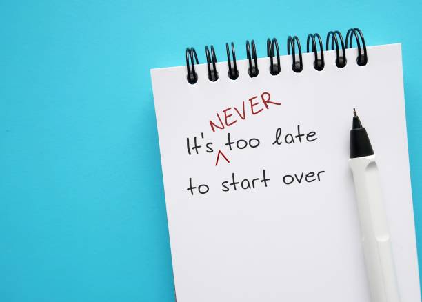 istock Notebook on copy space blue background with handwriting - It's never too late to start over - means to get out of a rut in career path, relationship or unhealthy habit, embrace new beginnings 1497809026