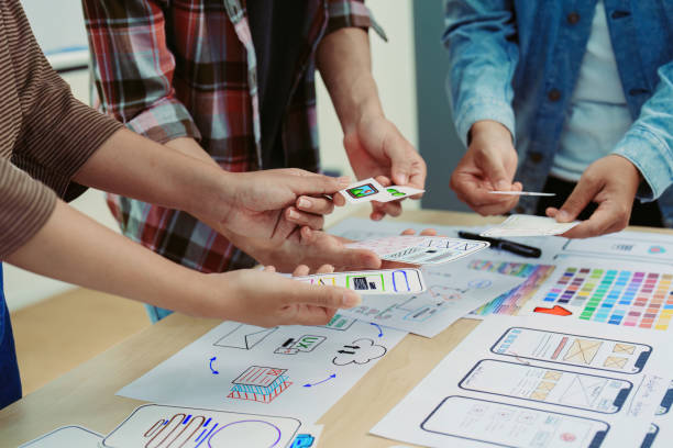 istock Team of Creative Web, Graphic Designer planning for mobile phone, drawing website ux ui app for mobile phone application and development template layout, process to developing prototype wireframe. 1497809529