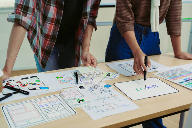 istock Team of Creative Web/Graphic Designer planning, drawing website ux ui app for mobile phone application and development template layout, process to developing prototype wireframe. 1497809597