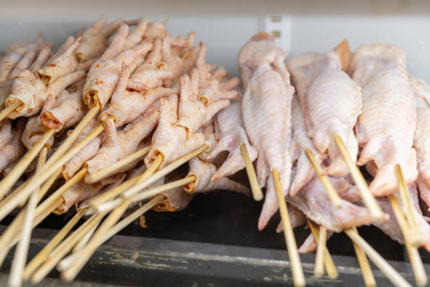 raw chicken wings and chicken feet in a refrigerator for babecue