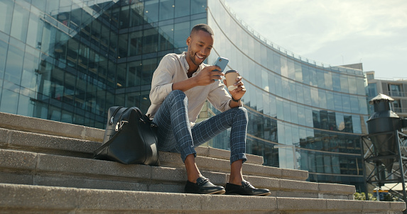 Black man, phone and business outdoor in a city with coffee, laughing and internet connection. Male entrepreneur person with a smartphone for communication, urban networking or online chat on break