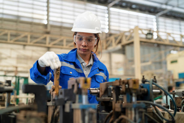 istock Checking equipment and machine before work prevents accidently. Asia mechanical engineer woman in the personal protective equipment (PPE) inspection pneumatic clamp in the production line at manufacturer. Prepare and inspect equipment before using welding 1497810559