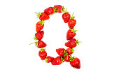 Letter Q made from ripe strawberries on a white background