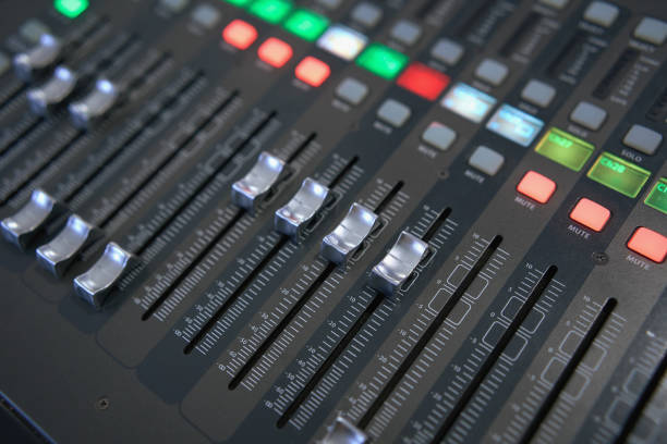 istock Professional audio mixing console. ​Mixer. Pro audio mixing board faders and knobs. Static shot of multi-track music recording equipment faders and sliders. 1497813190