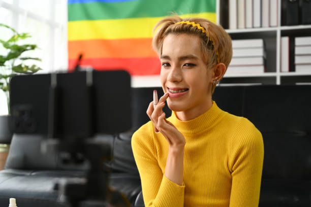 istock Charming young gay man blogger recording make up tutorial, live streaming at home. LGBTQ lifestyle, influencer, blogger. 1497813844