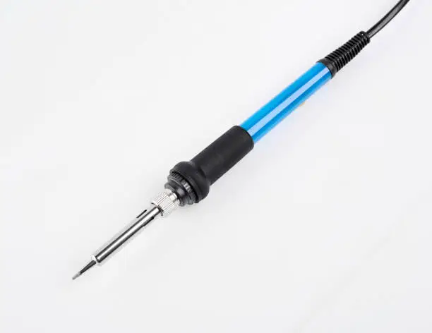 Soldering iron isolated on a white background. A tool for soldering wires, installing pipes, tinning or burning out.